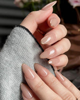 Clean Grace press-on nails in short almond shape — gold french tip nails