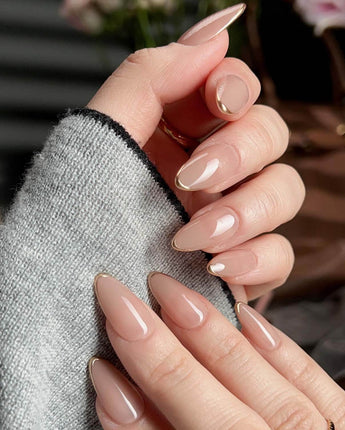 Clean Grace press-on nails in short almond shape — gold french tip nails