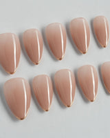 Clean Grace press-on nails in short stiletto shape — gold french tip nails