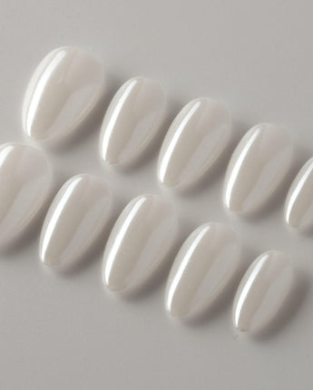 Clean Pearl press-on nails in extra short almond shape — white chrome nails