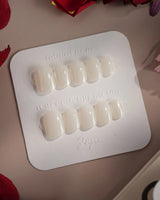 Clean Pearl press-on nails in extra short squoval shape — white chrome nails