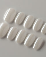 Clean Pearl press-on nails in short oval shape — white chrome nails