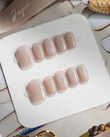 Clean Rainbow Cat-eye press-on nails in extra short square shape — pale pink cat eye nails