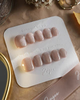Clean Rainbow Cat-eye press-on nails in extra short squoval shape — pale pink cat eye nails