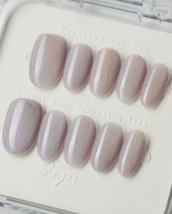 Clean Rainbow Cat-eye press-on nails in medium oval shape — pale pink cat eye nails