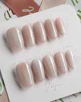 Clean Rainbow Cat-eye press-on nails in short coffin shape — pale pink cat eye nails