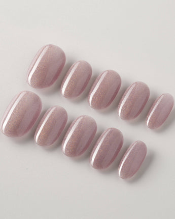 Clean Rainbow Cat-eye press-on nails in short oval shape — pale pink cat eye nails