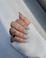 Clean Rainbow Cat-eye press-on nails in short almond shape — pale pink cat eye nails