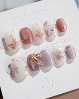 Clematis-Visionaria press-on nails in extra short squoval shape — Elegant Taro Purple, Hand-painted Clematis & Delicate Bow.
