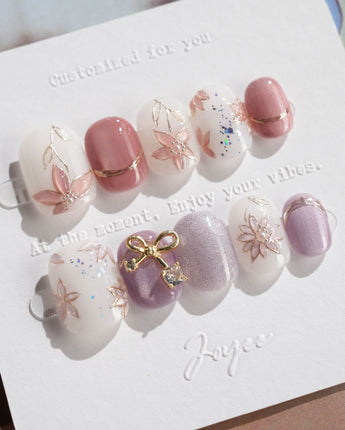 Clematis-Visionaria press-on nails in extra short squoval shape — Elegant Taro Purple, Hand-painted Clematis & Delicate Bow.