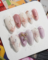 Clematis-Visionaria press-on nails in medium almond shape — Elegant Taro Purple, Hand-painted Clematis & Delicate Bow.