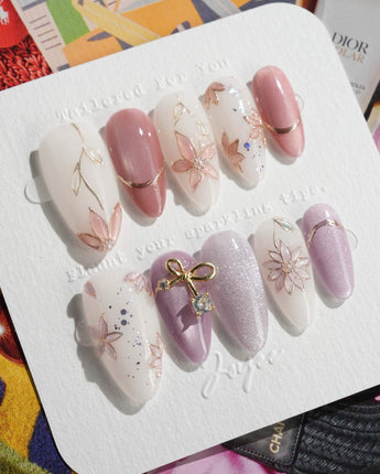 Clematis-Visionaria press-on nails in medium almond shape — Elegant Taro Purple, Hand-painted Clematis & Delicate Bow.
