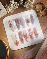 Clematis-Visionaria press-on nails in medium stiletto shape — Elegant Taro Purple, Hand-painted Clematis & Delicate Bow.