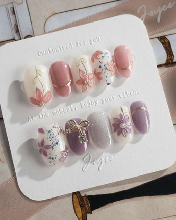 Clematis-Visionaria press-on nails in short oval shape — Elegant Taro Purple, Hand-painted Clematis & Delicate Bow.