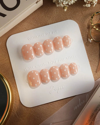 Cloud Cream press-on nails — Peach Nude, Sweet White Polka Dots. handmade nail art by Joyee Nails
