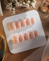 Cloud Cream press-on nails — Peach Nude, Sweet White Polka Dots. handmade nail art by Joyee Nails