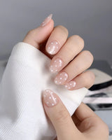 Cloud Cream-Mini nail art close-up showing Peach Nude, Sweet White Polka Dots. details