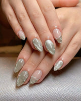 Clover Field nail art close-up showing Fresh Grass Green, Hand-painted Metallic Florals & French Pearl Outlines. details