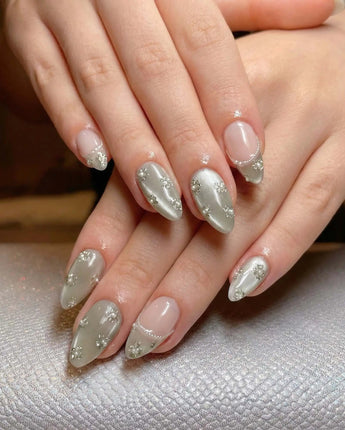 Clover Field nail art close-up showing Fresh Grass Green, Hand-painted Metallic Florals & French Pearl Outlines. details