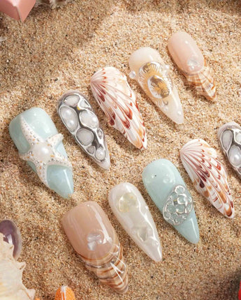 Coastline Edit handmade press-on nails featuring Azure & Nude Ocean Style, 3D Shells, Starfish & Pearls.