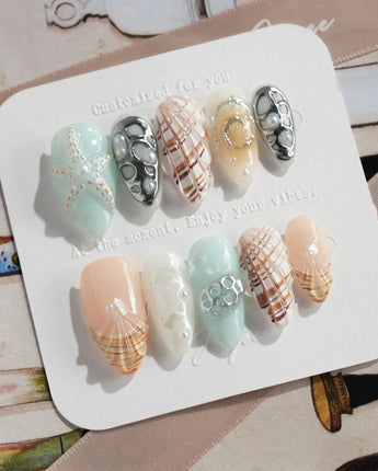 Coastline Edit press-on nails with pearly shell art and silver coastal details