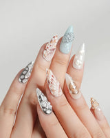 Coastline Edit moody seashell nails with silver, brown, and gold tide accents