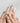 Beach-themed conch design nails