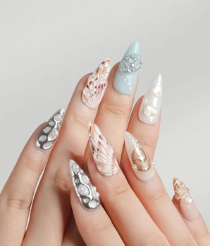 Coastline Edit moody seashell nails with silver, brown, and gold tide accents