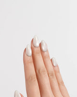 Coco Water nail art close-up showing Milky Jelly White, Minimalist Silver cat eye French Tips. details