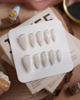 Coco Water press-on nails in short stiletto shape — Milky Jelly White, Minimalist Silver cat eye French Tips.
