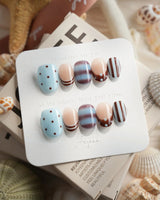 Cocoa Dot extra short oval press-on nails with blue brown polka dot art