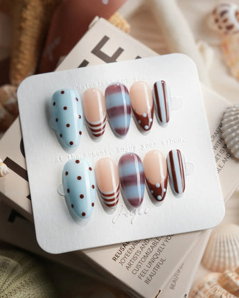 Cocoa Dot medium almond press-on nails with chocolate stripe and marble pattern mix