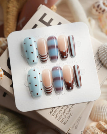 Cocoa Dot medium coffin press-on nails with chocolate brown and baby blue dot pattern