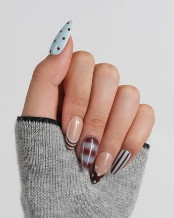 Cocoa Dot glossy blue and brown press-on nails with playful mixed patterns