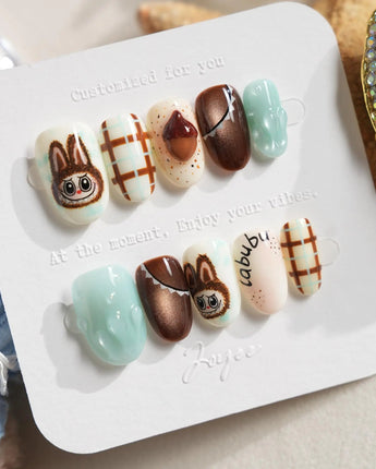CocoaBoo Labubu handmade nails with jelly paw charm, mint accents, and cocoa brown details