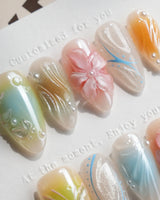 Color Rush nail art close-up showing Aurora Glaze Style, 3D Smudged Florals & Fluid Water Ripples. details