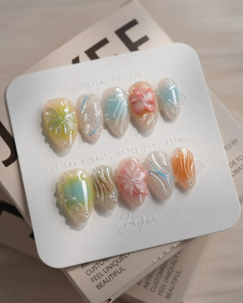 Color Rush press-on nails in extra short almond shape — Aurora Glaze Style, 3D Smudged Florals & Fluid Water Ripples.