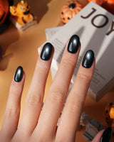 Comet spotlight cat eye press on nails, black with a cool silver magnetic glow - image 1