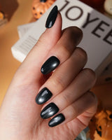 Comet spotlight cat eye press on nails, black with a cool silver magnetic glow - image 4