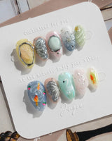 Como Blue extra short almond nails with 3D butterfly and pastel lake-water shimmer