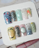 Como Blue medium square nails with Lake Como blue ripples, koi, and butterfly accents