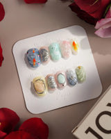 Como Blue short oval nails with Lake Como water shimmer, butterfly wings, and koi details