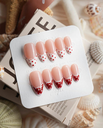 Coquette Dot glossy coquette nails with red French tips and white polka dots