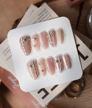 Coquette Dreams nails in short almond — Gentle Cinnamon Pink Cat-eye,