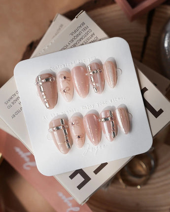 Coquette Dreams nails in short almond — Gentle Cinnamon Pink Cat-eye,
