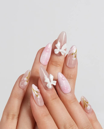 Coquette Garden press-on nails in short almond shape — Gentle Pink Gradient, 3D White Bows & Hand-painted Tulips.