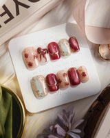 Coquette Red short square press-on nails with red chrome, nude base and gold rose details