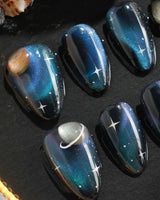 Cosmoseek handmade press-on nails featuring Deep Blue Galaxy Cat-eye, 3D Planets & Stars.