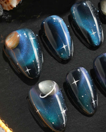 Cosmoseek handmade press-on nails featuring Deep Blue Galaxy Cat-eye, 3D Planets & Stars.