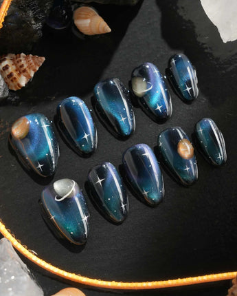Cosmoseek galaxy press-on nails with metallic blues and sparkling star details